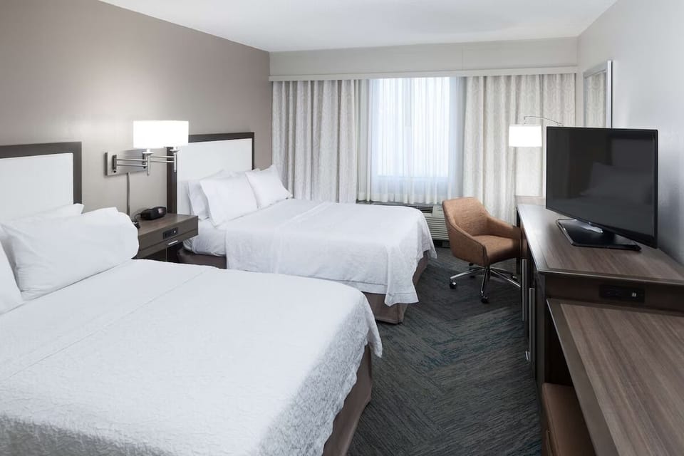 Settle into crisp beds for a restful night’s sleep.