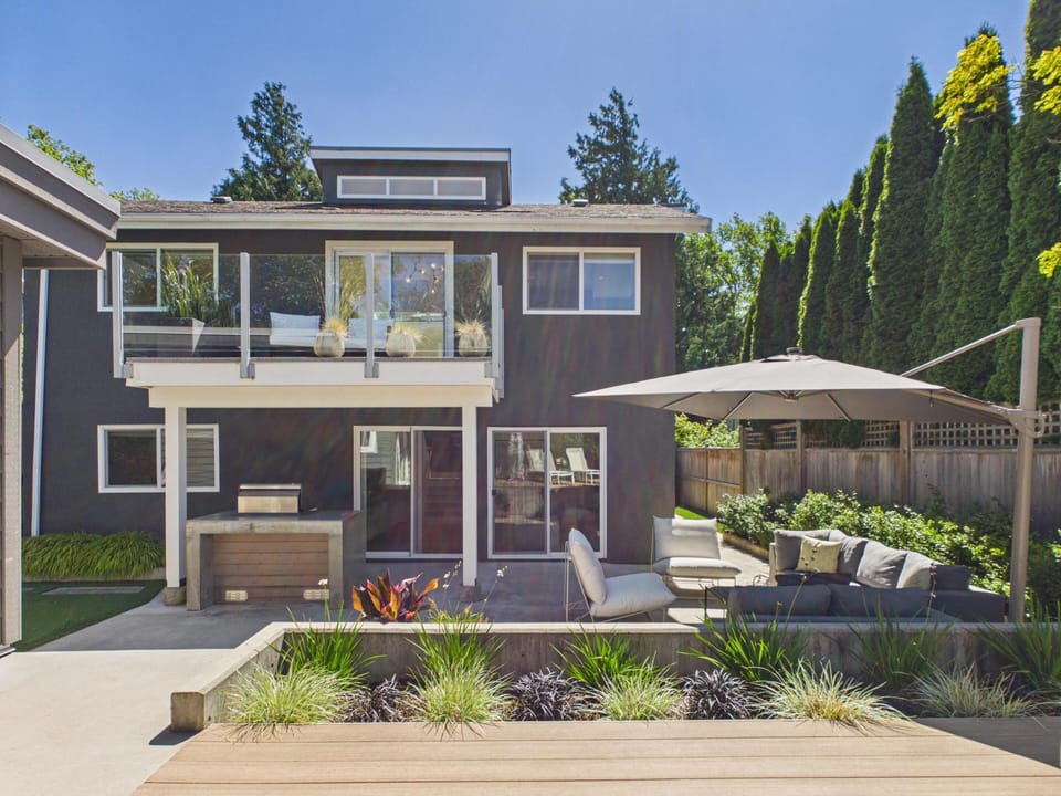 Welcome to the ultimate indoor-outdoor flow! These massive sliding glass doors fill the living room with gorgeous natural light, opening right up to your private back patio.