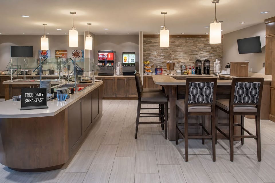 Breakfast dining area with food stations and seating.
