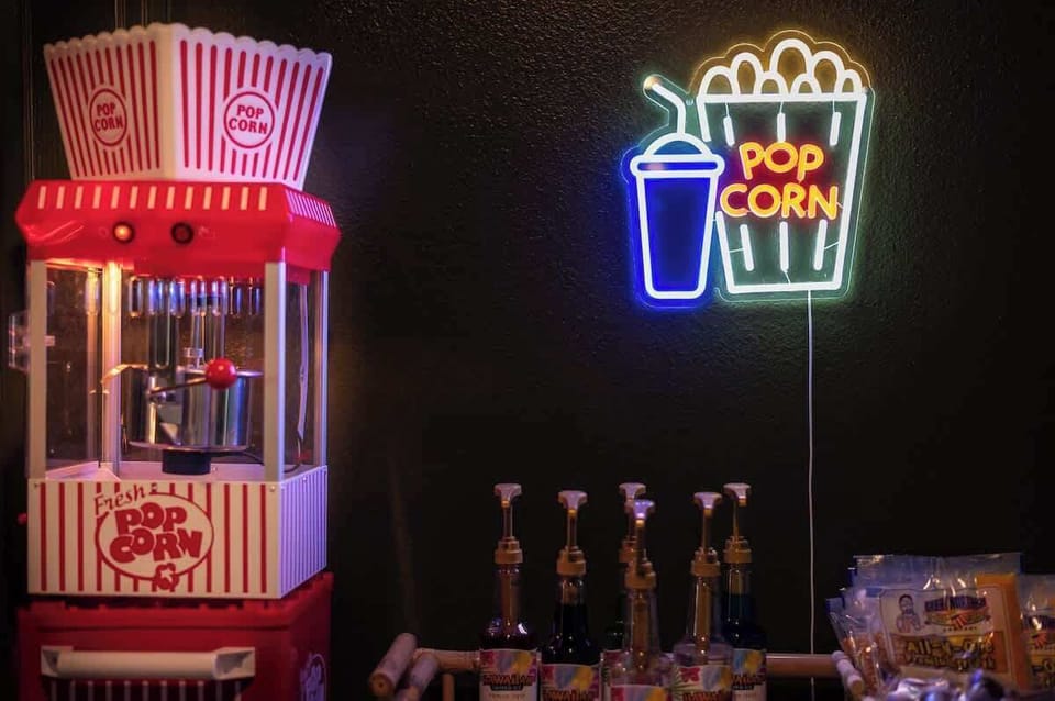 Popcorn machine: Neon vibes, snacks, and all the entertainment you can handle.