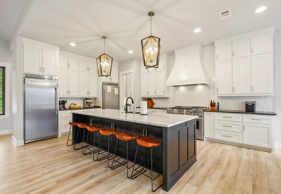 Bright finishes, modern appliances, and generous counter space make this kitchen as functional as it is beautiful.
