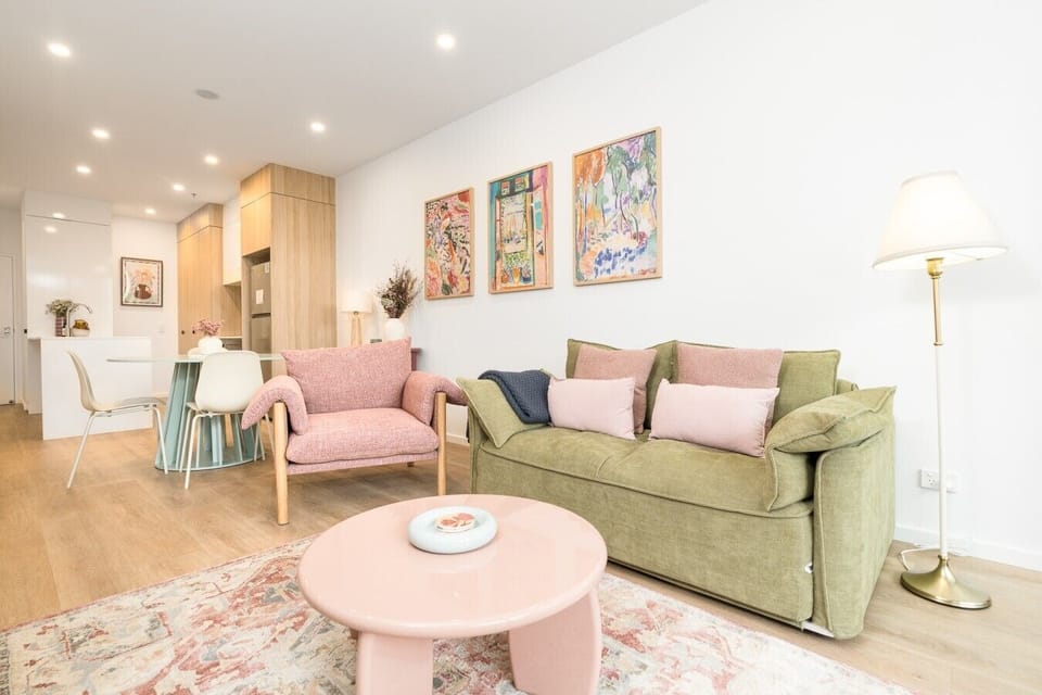 Sink into the comfy lounge and make yourself at home in this warm and inviting living space, perfect for relaxing after a busy day.