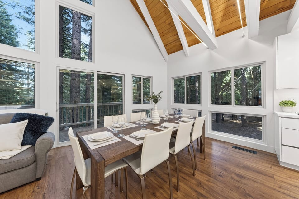 Host memorable dinners under dramatic vaulted ceilings with views of the surrounding forest.
