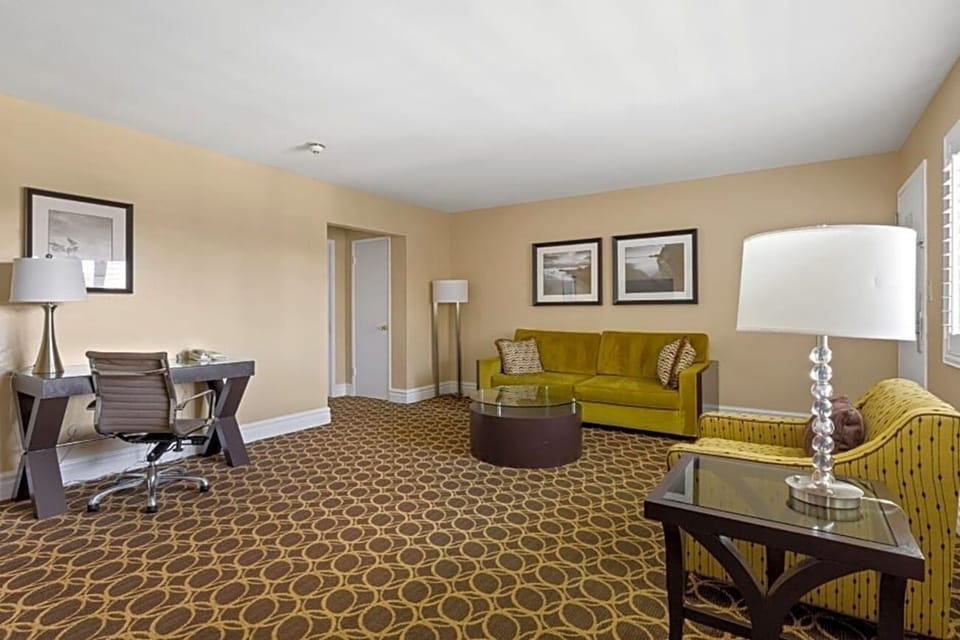 Relax on the sofa in a spacious suite made for lounging.