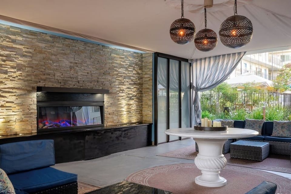 Unwind fireside under glowing lanterns in this chic lounge