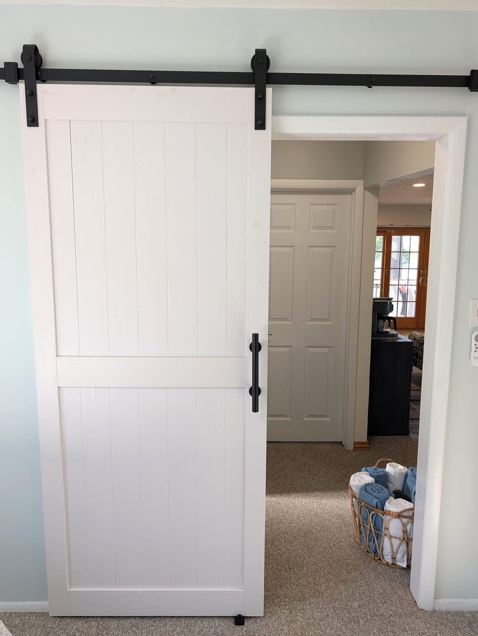 BEDROOM #2 (MAIN FLOOR):  Features a queen-size bed, private desk and chair, and a closet.