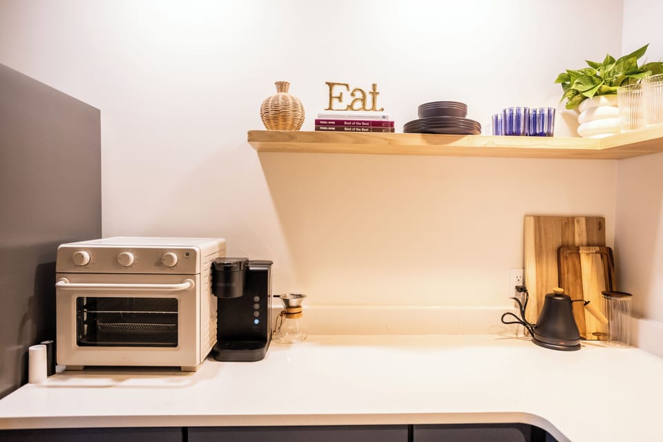 Air fryer-toaster oven, cutting boards, & Keurig coffee maker.