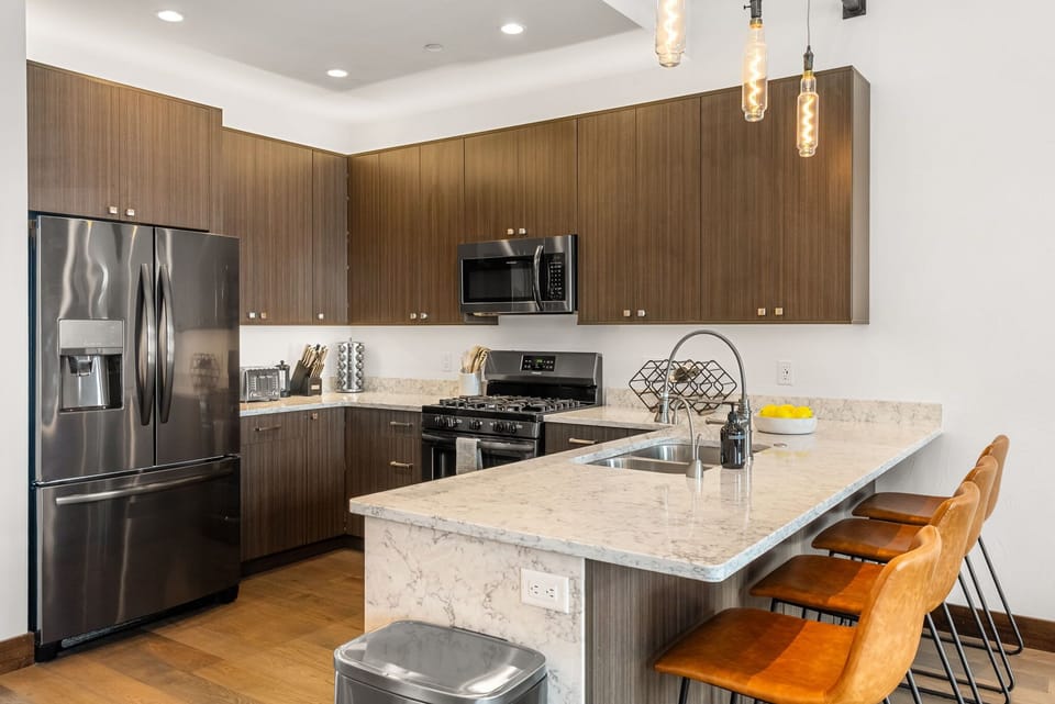 Kitchen: Drip coffee maker, Keurig coffee machine, blender, toaster oven, tableware, main floor
