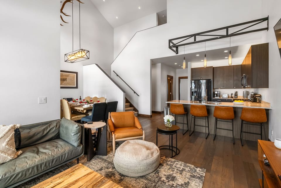 Living room: Gas fireplace, vaulted ceilings, mid-century modern furniture, main floor

