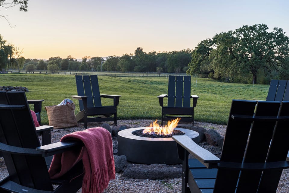 Gather around your private fire pit as the sun sets over rolling pastures and oak trees—a perfect spot to unwind with evening drinks and stories.