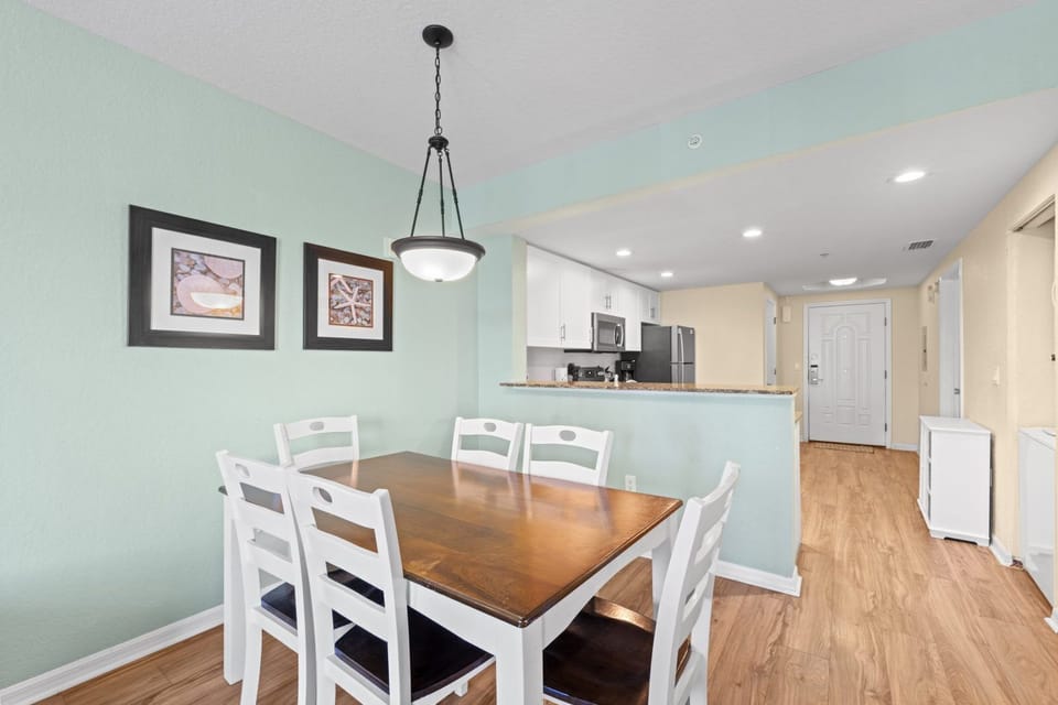 Gather around the dining table, perfect for sharing meals and creating memories just steps from the kitchen.