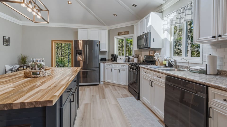 Featuring stainless steel appliances for a clean, modern touch and reliable everyday use, the space is both stylish and functional.