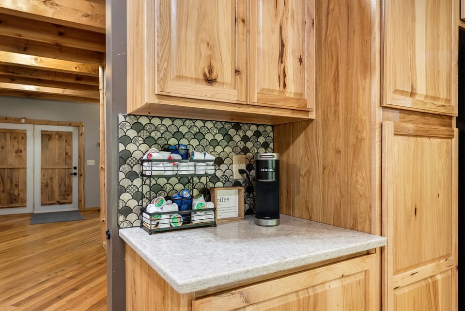 Coffee bar with Keurig coffee maker.