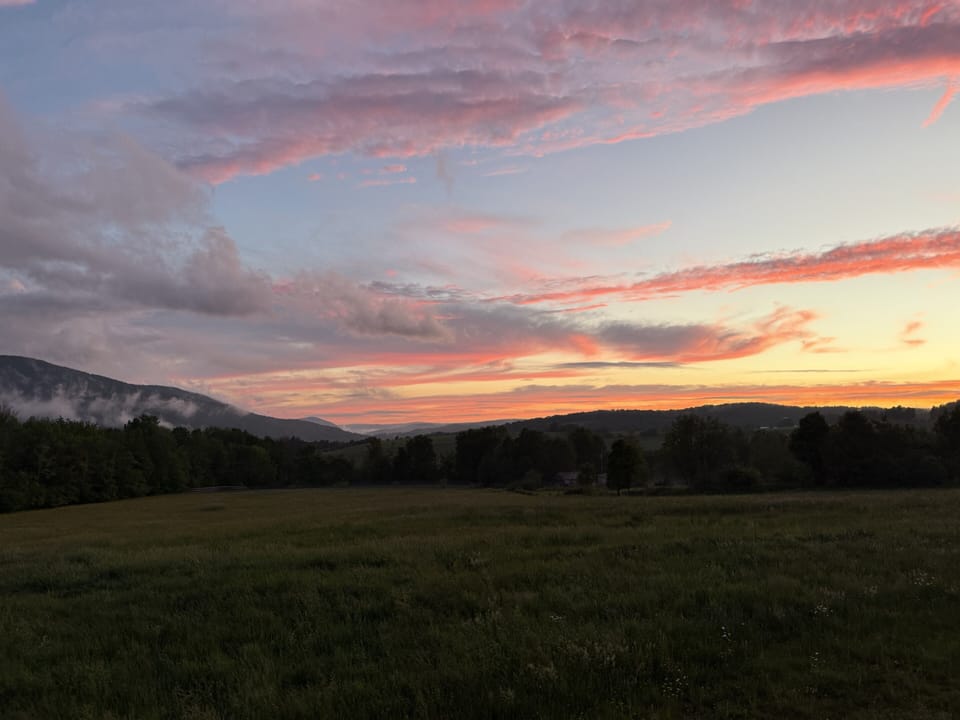 Peaceful meadow and mountain sunset views right from the property