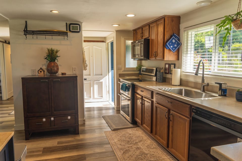 A bright, welcoming kitchen where form meets function, ready for cooking, gathering, and shared moments.
