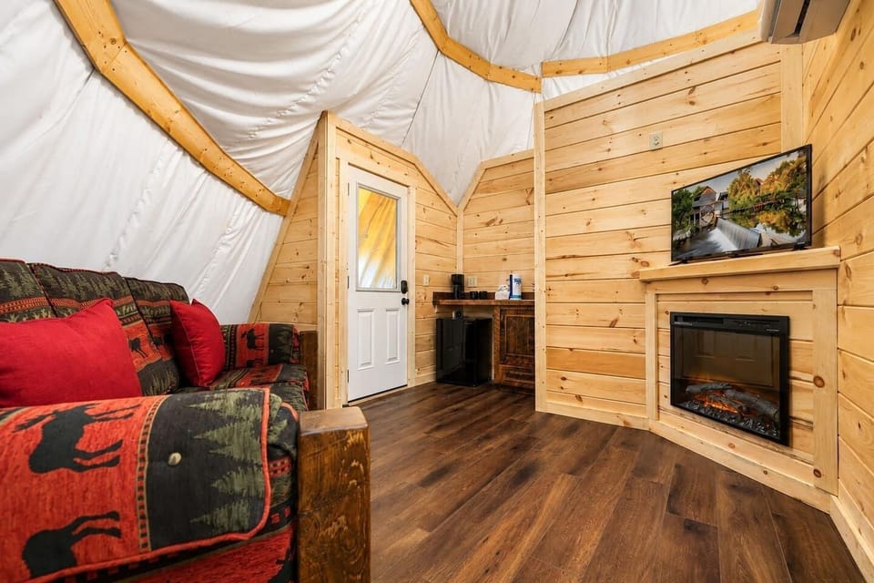 Cozy interior living area entrance with comfortable seating and rustic wood .