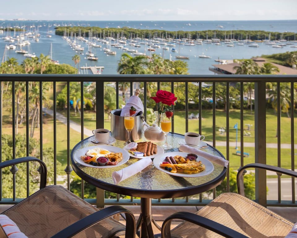 Savor a delightful breakfast on the balcony, complete with stunning marina views.