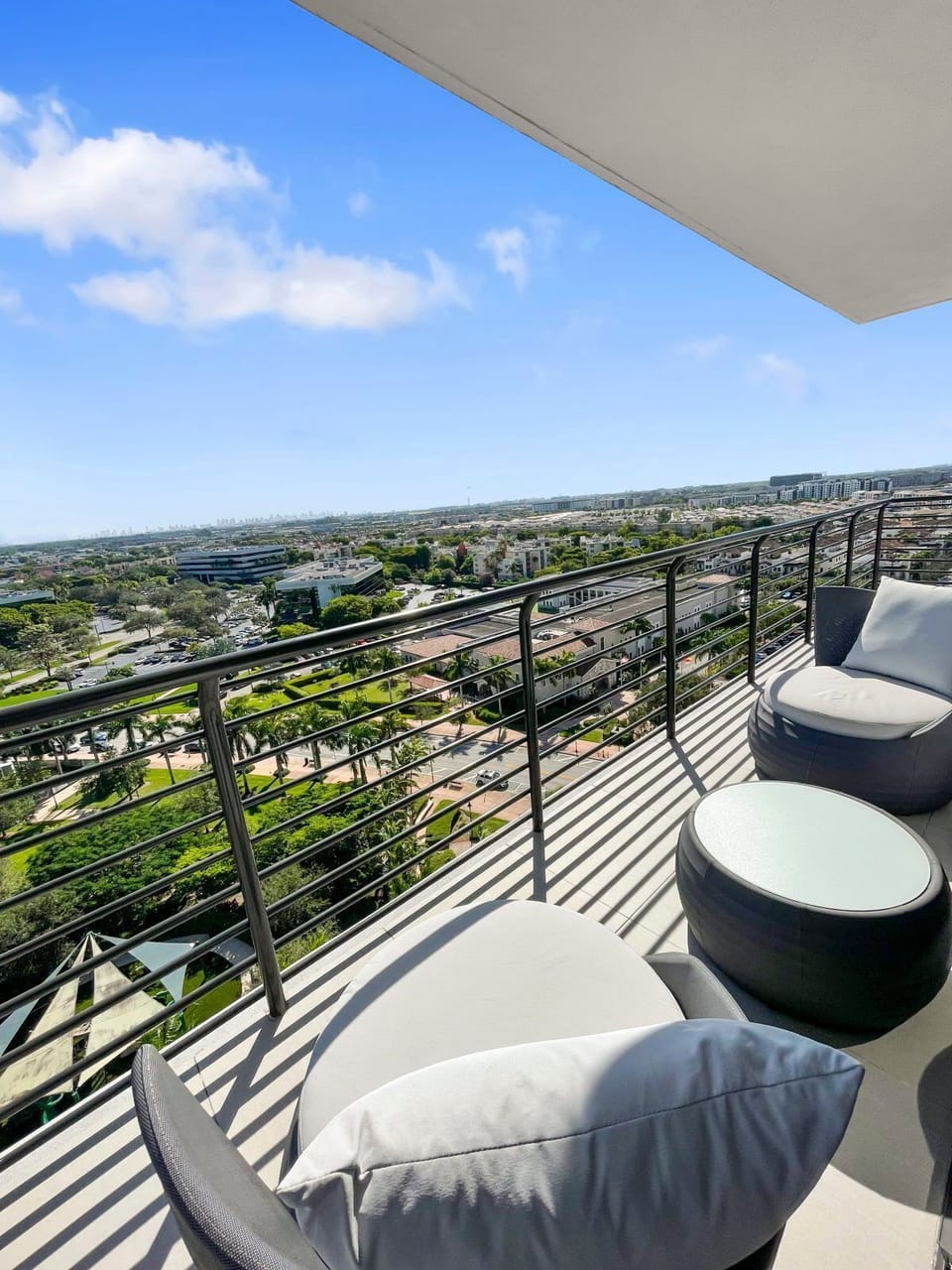 Savor moments outdoors on the stylish balcony, complete with comfy seating and inviting light.