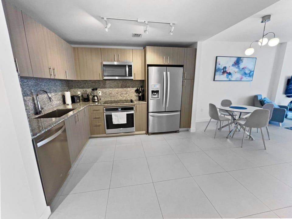 Cook up a feast in the modern kitchen, featuring sleek appliances and stylish cabinetry.