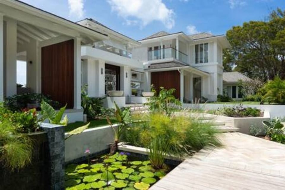 Calming water features and impeccable gardens add to the relaxed ambiance of the property.