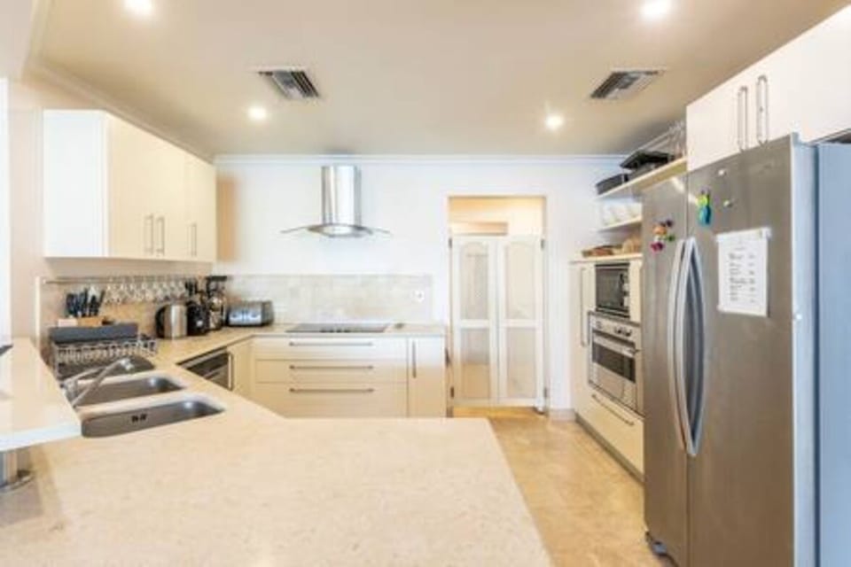 Well equipped kitchen with a breakfast bar, coffee maker, dishwasher, kettle, tumble dryer and washing machine.