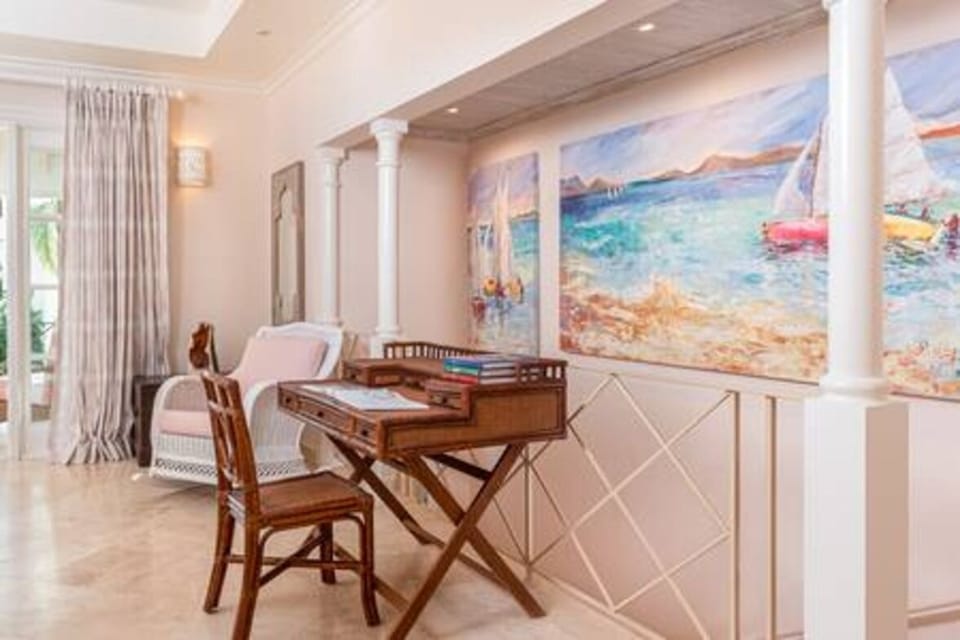 Spacious en suite bedroom with US king size bed, air conditioning, ceiling fan and a private balcony.