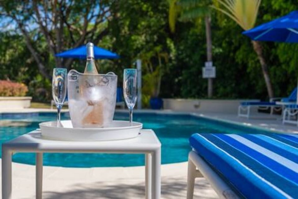 Beautiful private pool with sun beds, parasols and views over the private gardens.