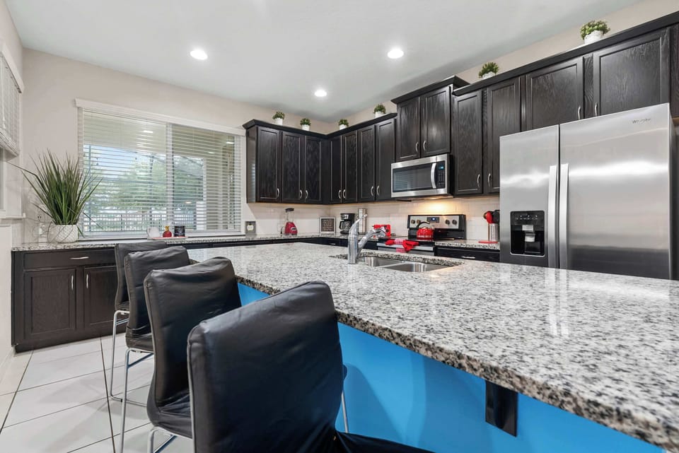 Modern kitchen with granite countertops and stainless steel appliances