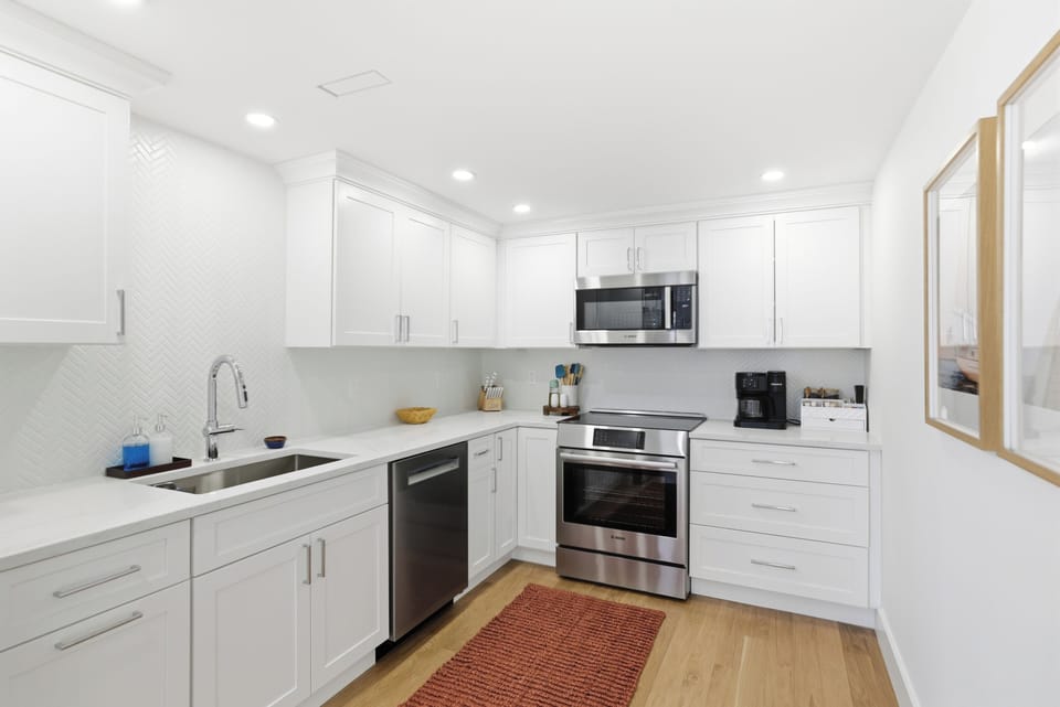 Plenty of room for helpers! Whip up a gourmet feast in this sunlit, sleek space.