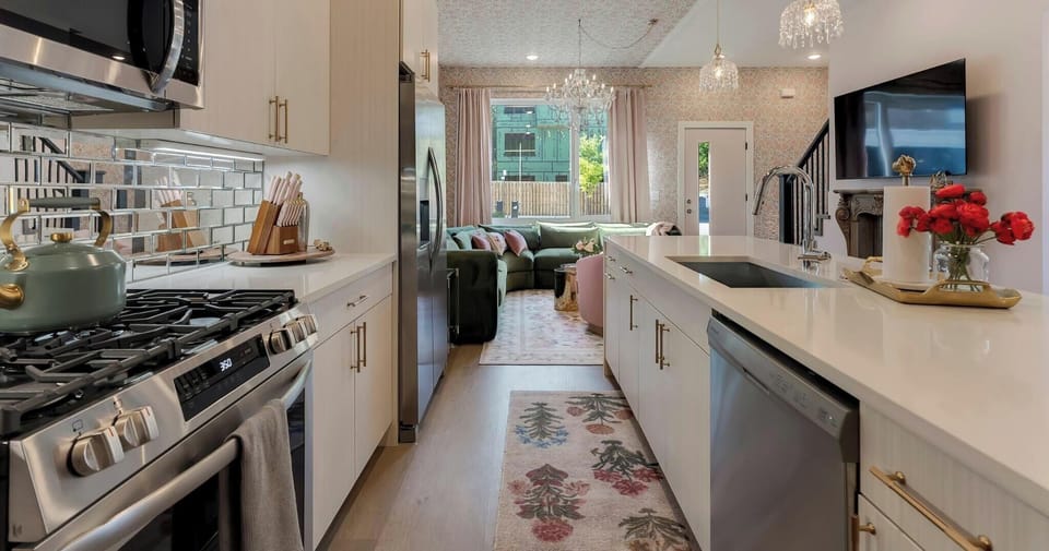 Modern, fully stocked kitchen perfect for home-cooked meals!