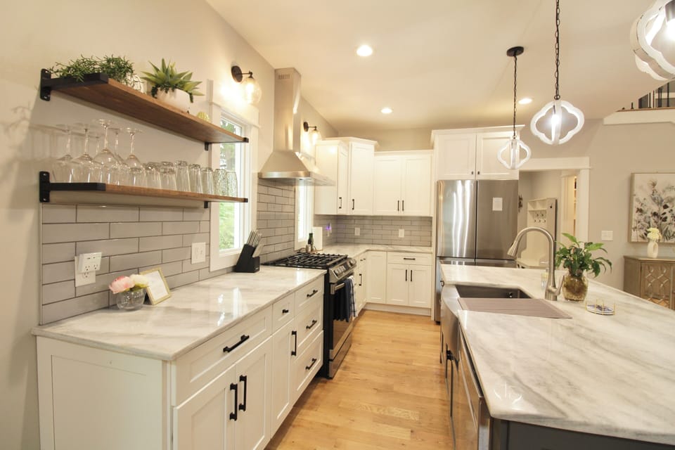 Fully equipped kitchen with quartz countertops and stainless-steel appliances.