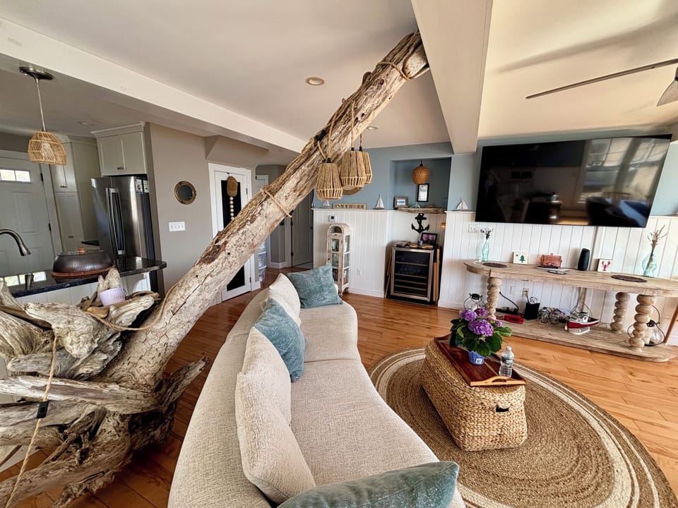 Open concept living room/dining room with 72” smart tv with you tube live. 