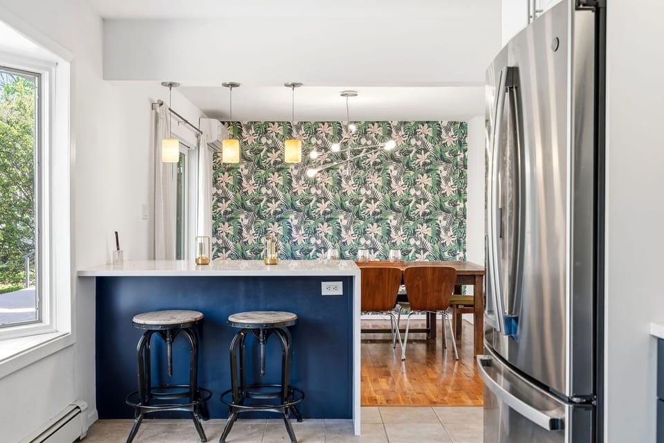 Breakfast bar with seating for two and pendant lighting
