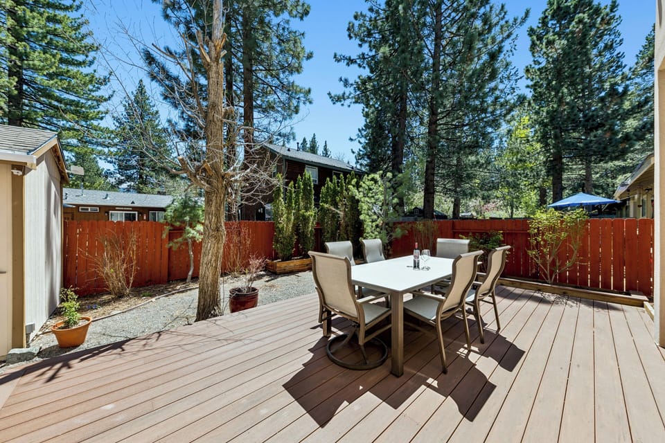 Gather around your private outdoor dining table, surrounded by towering pines and fresh mountain air—perfect for morning coffee or evening meals under the open sky.