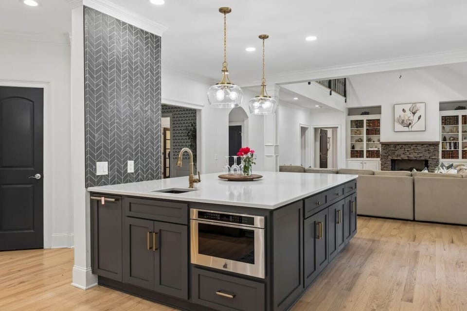 Gourmet kitchen with a huge kitchen island, high-end appliances, wine fridge and all the supplies you would need for cooking a meal with your family.