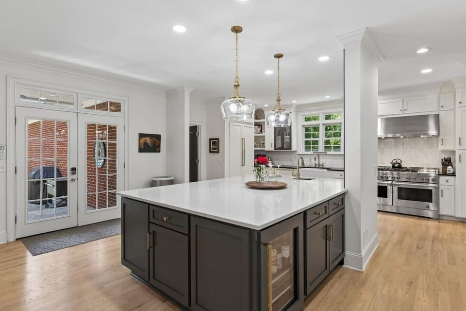 Gourmet kitchen with a huge kitchen island, high-end appliances, wine fridge and all the supplies you would need for cooking a meal with your family.
