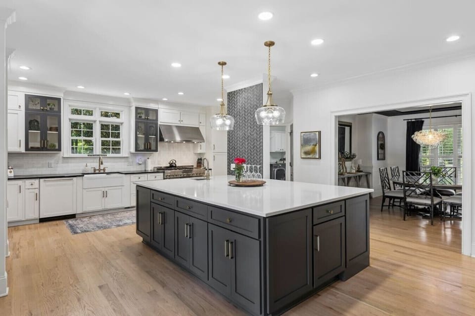Gourmet kitchen with a huge kitchen island, high-end appliances, wine fridge and all the supplies you would need for cooking a meal with your family.