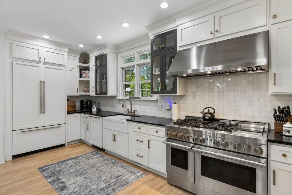 Gourmet kitchen with a huge kitchen island, high-end appliances, wine fridge and all the supplies you would need for cooking a meal with your family.