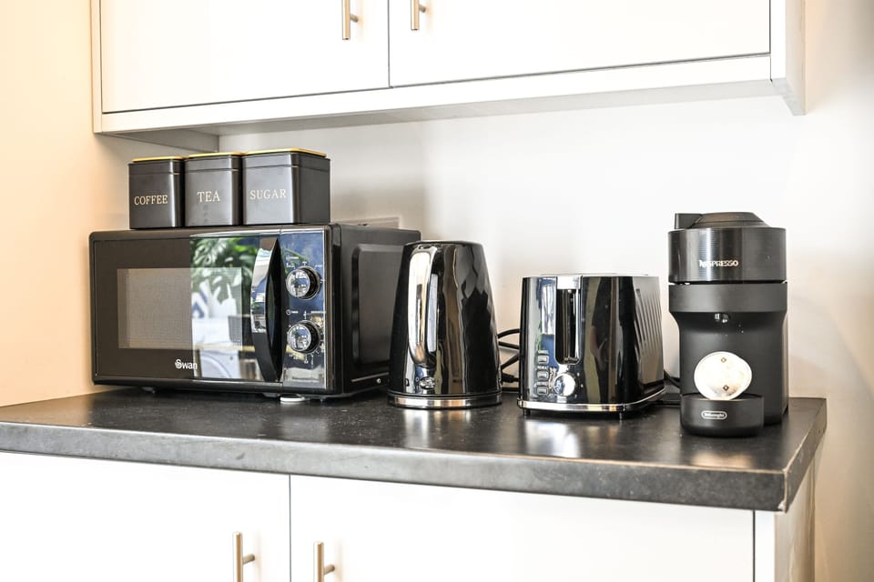 Microwave, kettle, toaster and pod coffee machine, with tea, coffee and sugar canisters