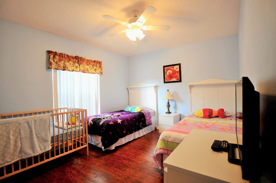 4th bedroom with two Full size twin beds and crib