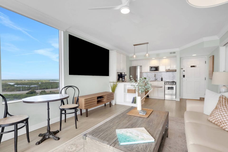 While the balcony showcases sweeping Estero Bay views, the large picture window offers a glimpse west to Lovers Key State Park and the Gulf beyond.