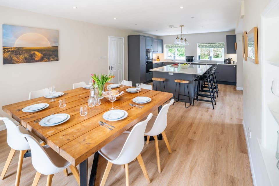 Ground floor: Large kitchen and dining table, with access to the dining patio