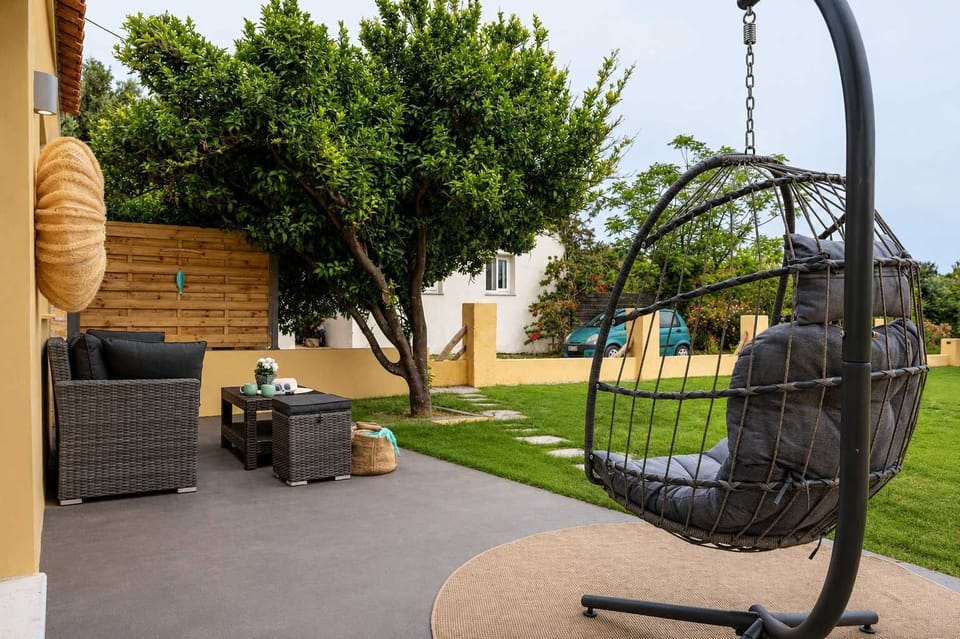 Shaded Outdoor Lounge with Hanging Chair