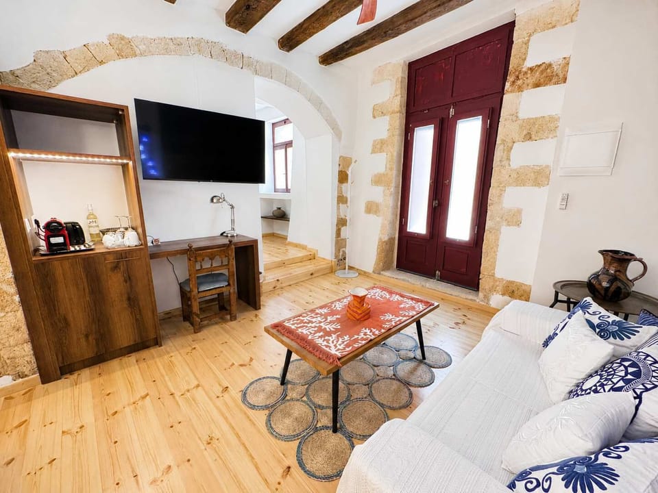 Elegant bedrooms with comfortable bedding, exposed beams, and private bathrooms for optimal comfort