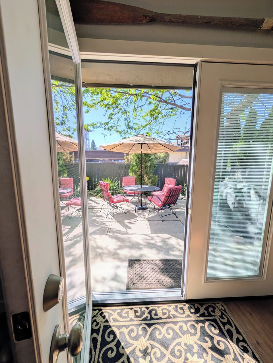 Enjoy exclusive access to a private patio. With seating for 4-6 guests, a premium propane grill, and plenty of shade from a large tree and umbrella, it's the perfect spot for summer BBQs and outdoor dining after a day at the lake.