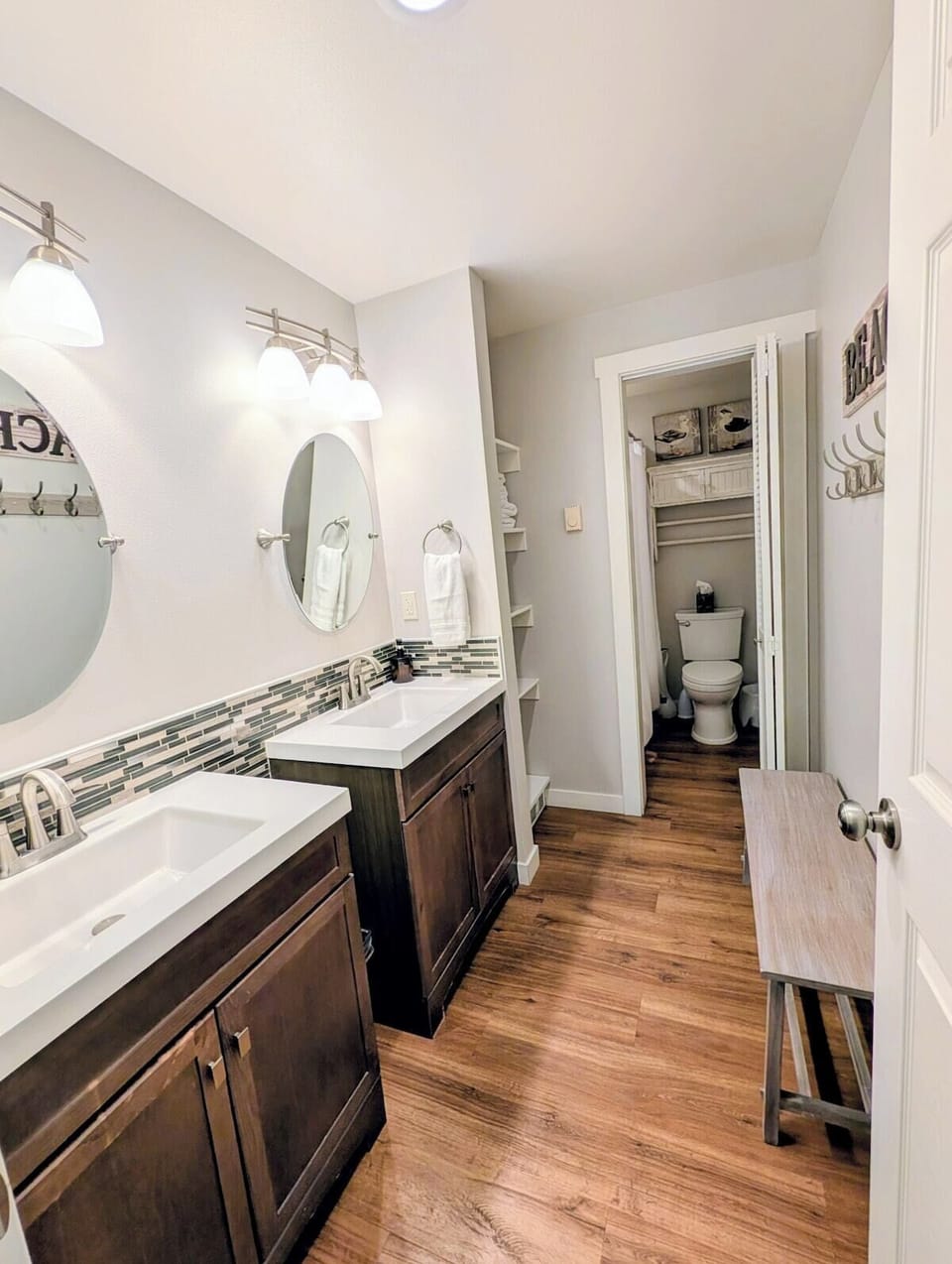 This spacious shared bathroom is centrally located within the condo and easily accessible from both bedrooms. It features two sinks, plush towels, a full-sized bath/shower combo, and essential toiletries to help you settle in comfortably.