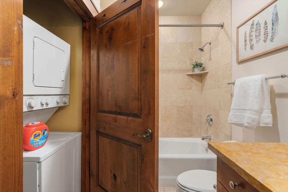 Bathroom with a washer and dryer