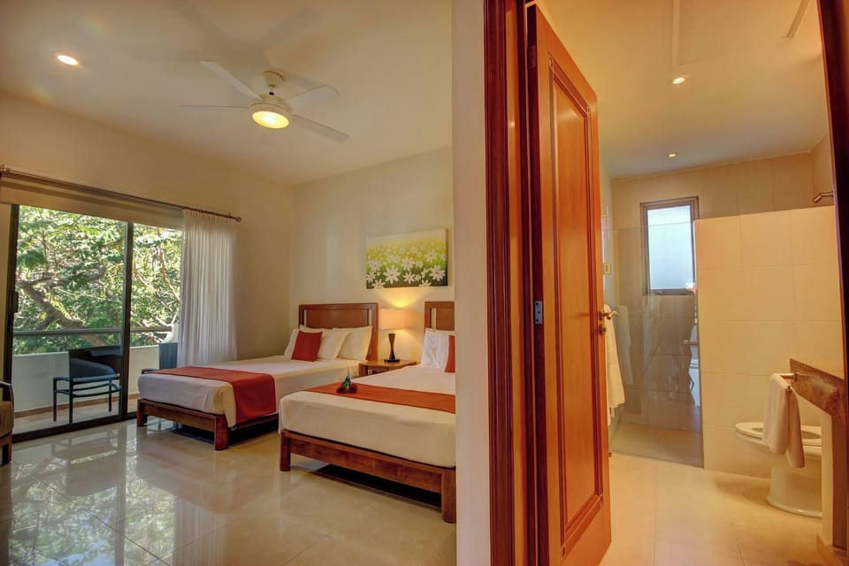 Second bedroom with 2 double beds and full bathroom with amenities