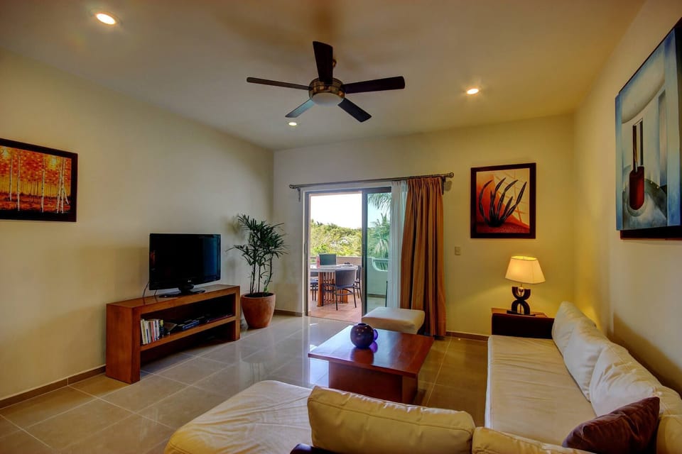 The living room has cable TV and Wi-Fi. It's a space with plenty of natural light and fresh sea air.