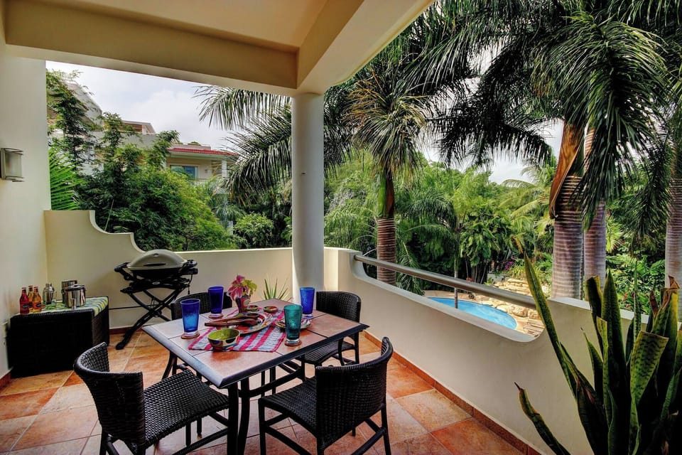 Enjoy the view of the garden and pool from your balcony